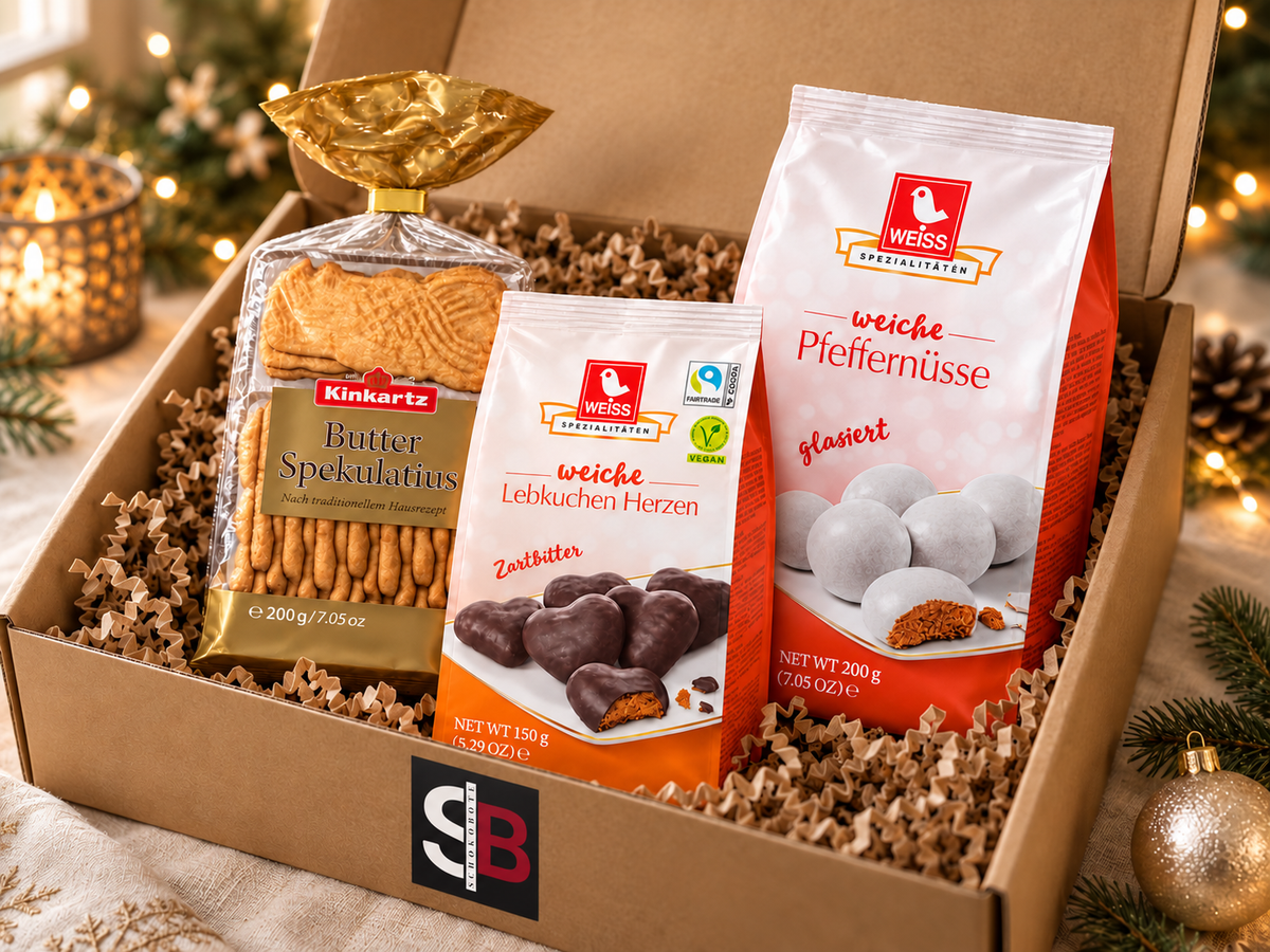 Mini Klassiker: Spekulatius, Pfeffernüsse und Lebkuchenherzen in geöffneter Weihnachtsbox – Karton mit Schokobote-Logo